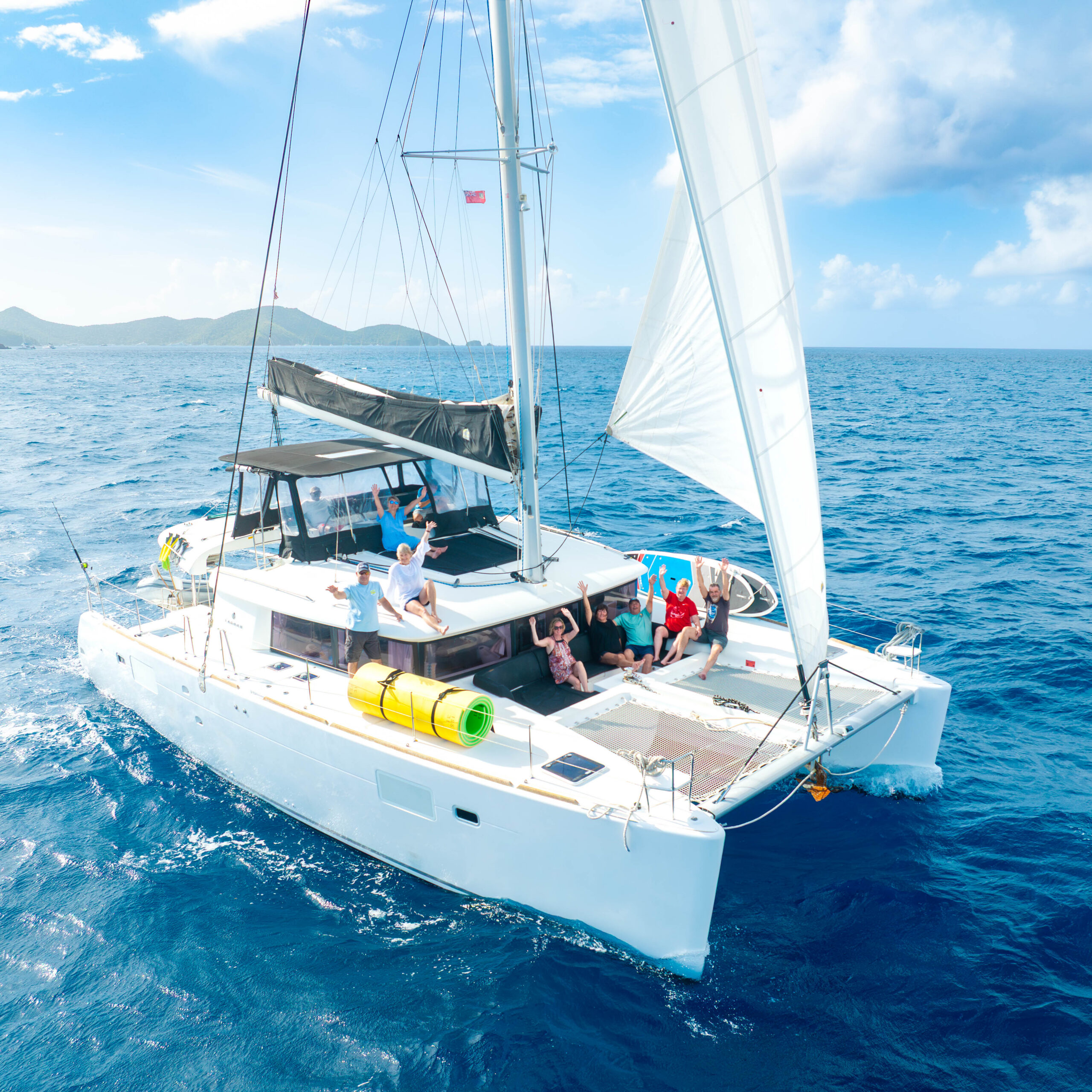 Max at the helm during a BVI cabin charter