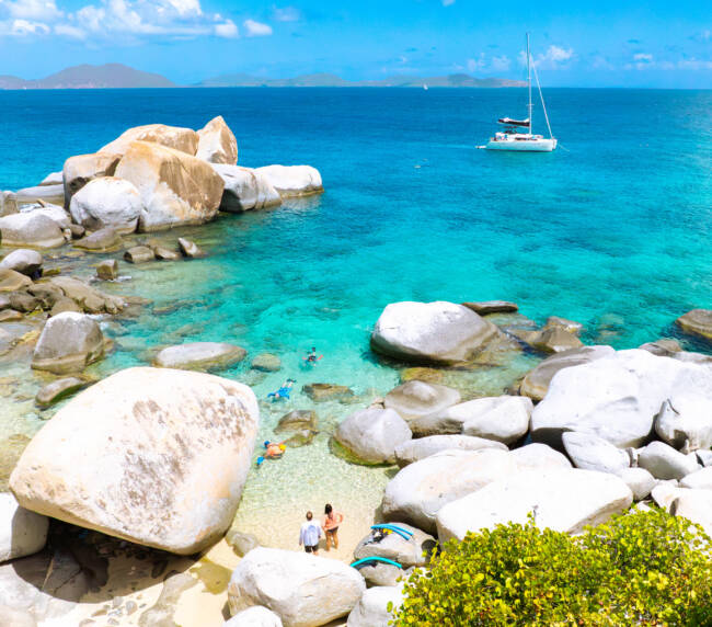 Snorkellers exploring a coral reef at one of the best BVI snorkelling spots